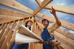 Female designers viewing a home being built